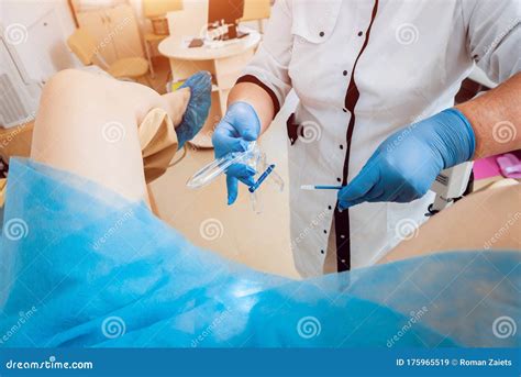 Woman In Gynecological Chair During Gynecological Check Up With Her Doctor Stock Image Image