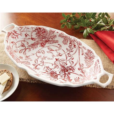 Stoneware Oval Bowl Features Holly Toile Pattern And Scalloped Handle