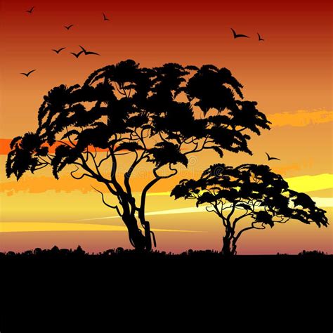 African Landscape With Sunset And The Silhouette Of Trees And Elephants