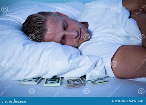 Man Sleeping With Currency Notes Kept Under His Pillow Stock Photo Image Of Financial Fear