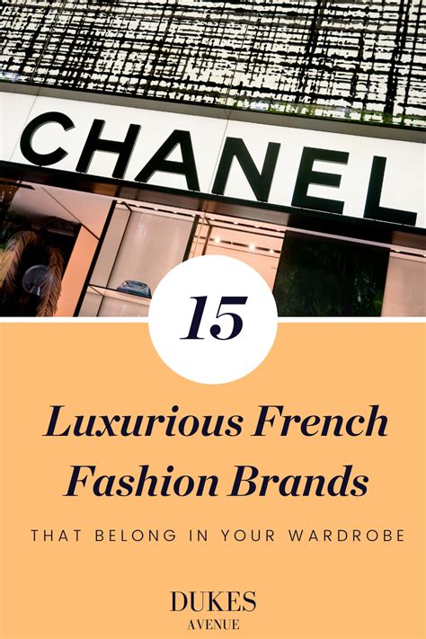 Two Women Walk By A Store Of Famous International French Luxury Brands