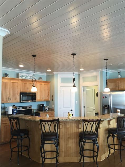 Knotty pine ceilings are often found in log cabins, where they contribute to a rustic or primitive look. Love the white wash pine ceilings | Diy kitchen remodel ...