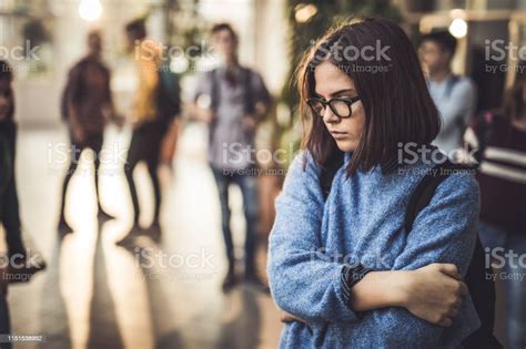 Sad High School Student Feeling Lonely In A Hallway Stock Photo
