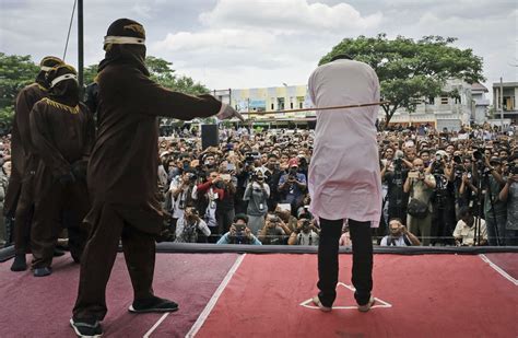 Two Indonesian Men Caned In Front Of Jeering Crowd For Having Sex
