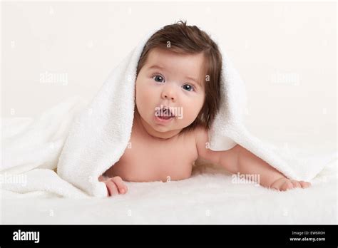 Happy Baby Under Towel On White Stock Photo Alamy