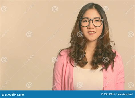 Portrait Of Happy Young Beautiful Asian Nerd Woman With Eyeglasses