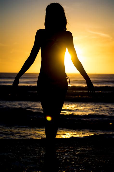 Free Photo Woman Walking At The Beach During Sunset Beach Dawn