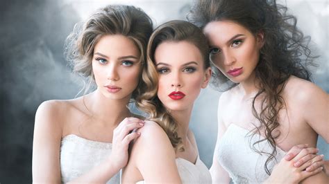 Three Beautiful Girl Models Are Posing For A Photo Wearing White Dress