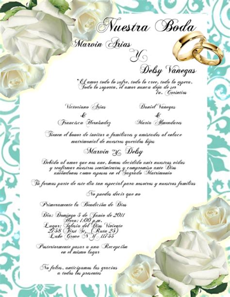 A Wedding Card With Two Rings On Top Of It And White Roses In The Middle