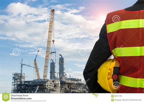 Hand Or Arm Of Engineer Hold Yellow Plastic Helmet Stock Image Image