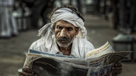 Man Reading The Newspaper