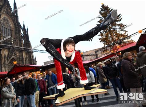 Contortionist Alina Ruppel Shows Off Her Skills On A Table At The Christmas Market In Cologne