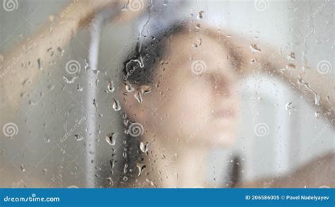 Beautiful Girl Taking Shower Behind Glass Selective Focus On Glass Drops Water Stock Image
