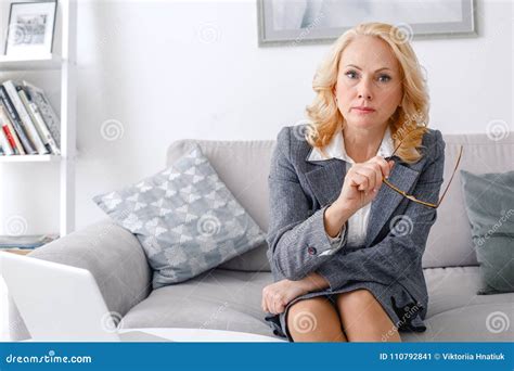 Woman Psychologist Portrait Sitting At Casual Home Office Looking Camera Serious Stock Image