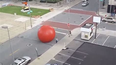 Giant Red Ball Tastes Sweet Freedom Goes On A Roll Down A City Street