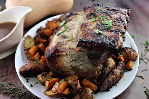 In a small bowl, mix together the olive oil, garlic, salt and pepper. Recipe For Bone In Pork Shoulder Roast In Oven : Two Men ...