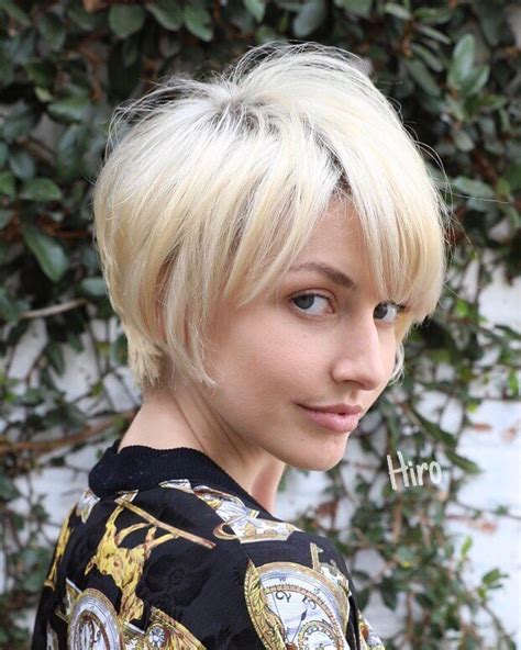 layered platinum blonde pixie with messy textured fringe and side swept bangs the latest