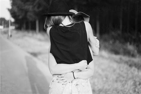 Two Female Friends Hugging From Behind Black And White By Stocksy Contributor Mak Stocksy