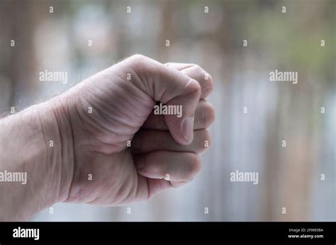 Male Hand Clenched Into A Fist Stock Photo Alamy