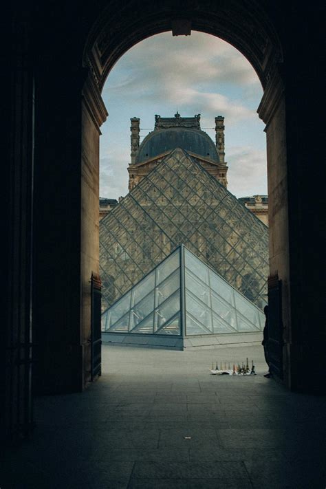 Photograph Of A Corridor In France With A View Of The Louvre Museum In