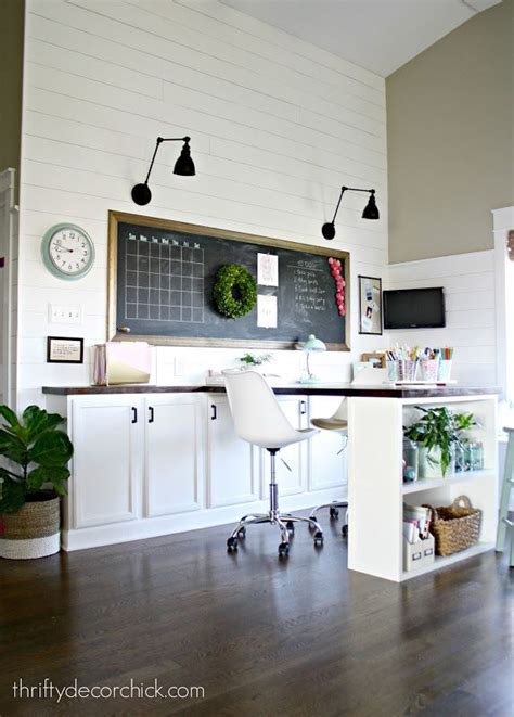 Sarah from making joy and pretty things did this by using ikea cabinets with a countertop as the desk and then installing extra trim. Our craft room, office, hang out space, wrapping station ...