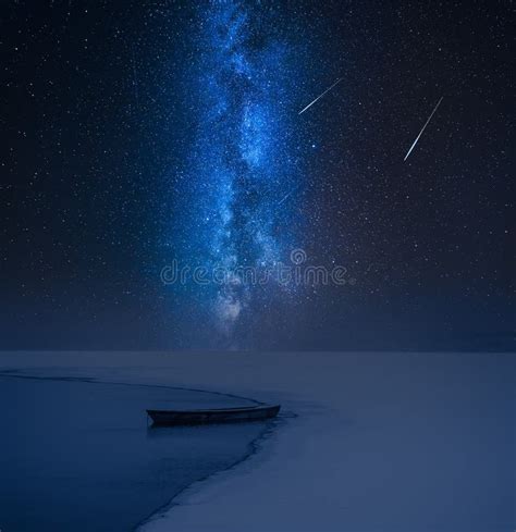 Milky Way And Alone Boat On Frozen Lake In Winter Stock Image Image