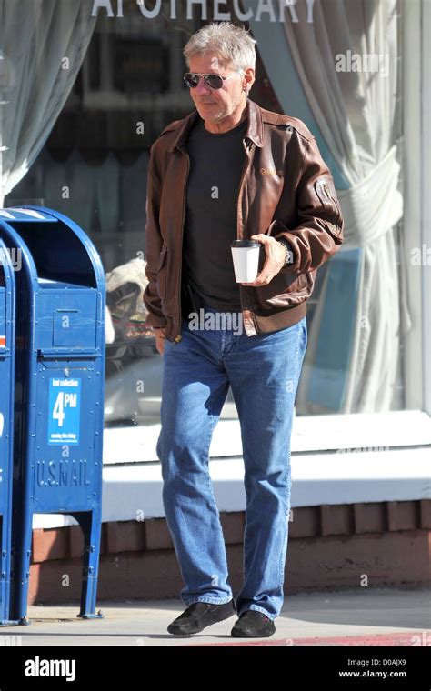 Harrison Ford In A Brown Leather Flying Jacket And Jeans Gets A Coffee