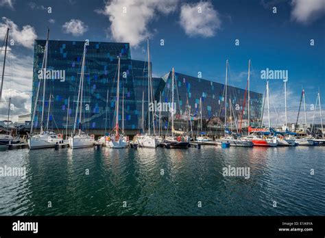 Reykjavik Harbor With Sailboats And Harpa Concert And Convention Center