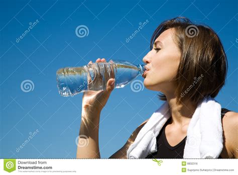 Girl Drinking Water While Exercise Royalty Free Stock