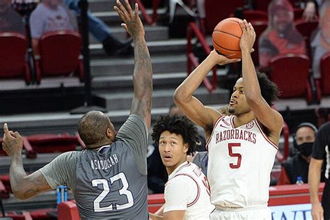 Arkansas' moses moody, right, shoots while guarded by kentucky's davion mintz during the second half of an ncaa college basketball game in lexington, ky., tuesday, feb. WholeHogSports - Arkansas hammers Lipscomb for 4th win