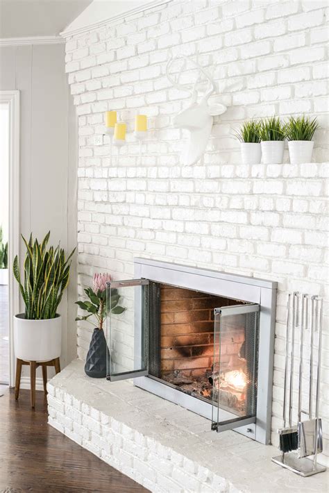 A White Painted Fireplace Gives A Modern Facelift To This Mid Century
