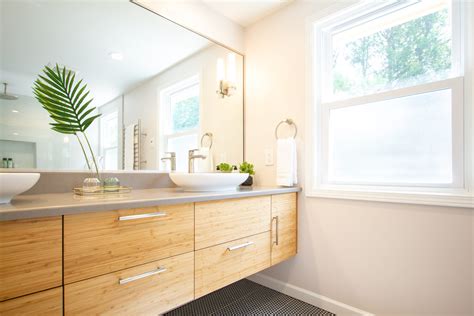 This hawaiian home takes nature to the interior by highlighting custom items like concrete bathtubs and sinks. Zen Inspired Bathroom with a Beautiful Bamboo Floating Vanity - Dura Supreme Cabinetry