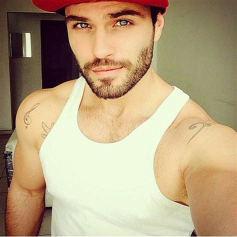 Blonde hair blue eyed men are seen as feminine and women generally go for men with darker hair and tanned skin. A Man's Face — Black hair, blue eyes, beard, mustache