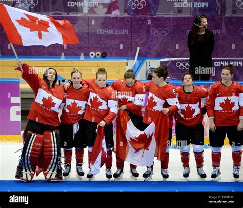members of canada s women hockey team celebrate a 3 2 overtime win over the usa at winter