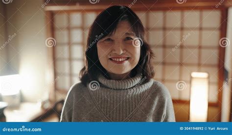 Smile Portrait And Mature Japanese Woman At Her Home With Positive Good And Confident Attitude