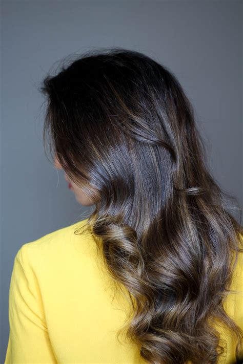 If your hair is thick, divide it in half from ear to ear first and clip away the top. How To Curl Your Hair With A Curling Iron