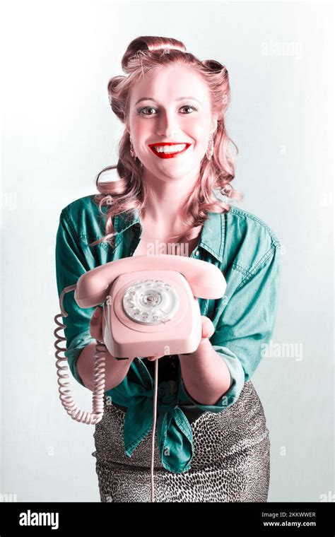 Beautiful Smiling Pinup Woman Holding Retro Turn Dial Phone In A