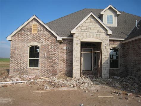 A beautiful stucco and brick home in la (dsldhomes.com). The Martin's New Home: 15. Brick, Stone and Stucco