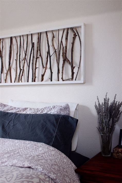 You can use the wall above bed to hang lighting and create a focal point for the room. DIY Branch Art Headboard | Bedroom wall decor above bed ...