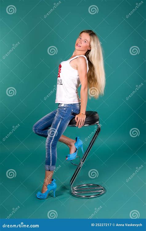 Blonde Sitting On A Bar Stool Stock Image Image Of Female Studio