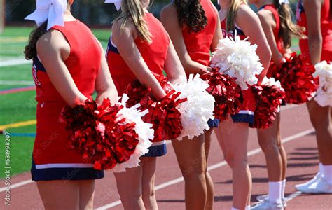 Rear View Of Cheerleaders On The Sideline With Their Pom Poms 素材庫相片 Adobe Stock