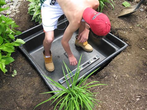 A reservoir, which is filled with water; How To Build A Hidden Water Fountain - Concord Carpenter
