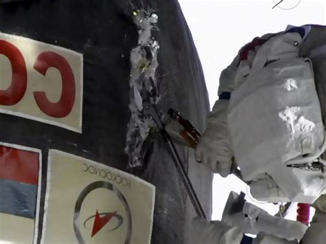 international space station russian space walk to inspect mystery hole on soyuz space craft