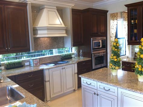 For a bold warm kitchen you can paint your cabinets a candy apple red and trim the inlays with black or two color kitchen cabinets ideas and exact paint color matches. TWO different color cabinets! Pretty nice looking | Home ...