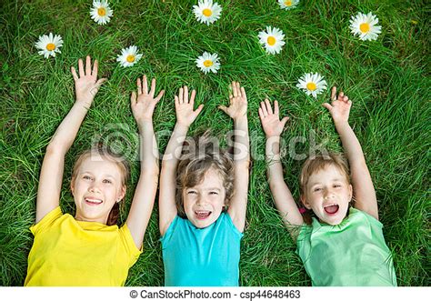 Group Of Happy Children Playing Outdoors Kids Having Fun In Spring