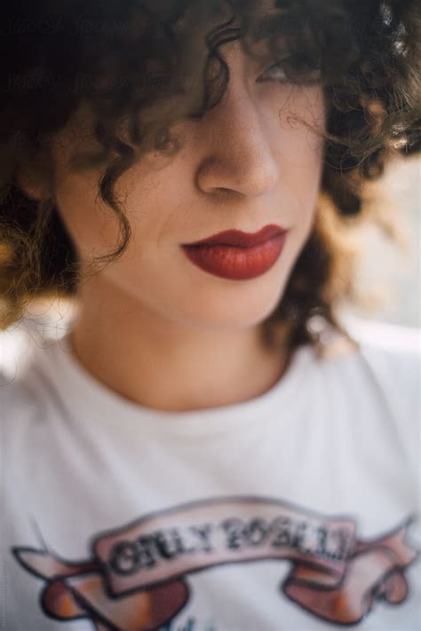 Portrait Of A Young Stylish Woman With A Curly Hair By Stocksy