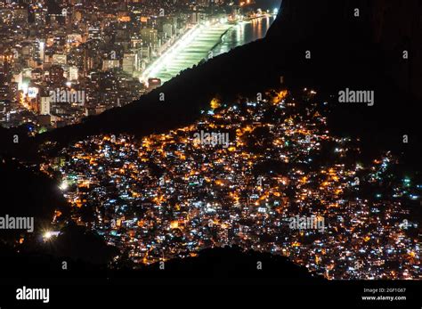 Aerial Night View Of A Slum And Ipanema Neighborhood In Rio De Janeiro