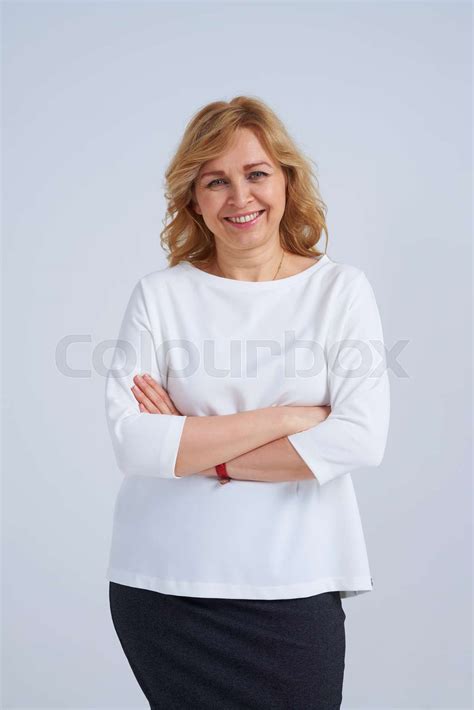 smiley mature blond posing stock image colourbox
