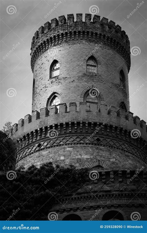 Grayscale Of A Medieval Tower Under The Cloudy Sky Stock Photo Image