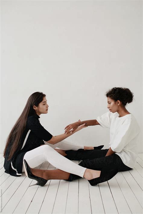 Portrait Of Two Women In White Studio By Stocksy Contributor Sergey